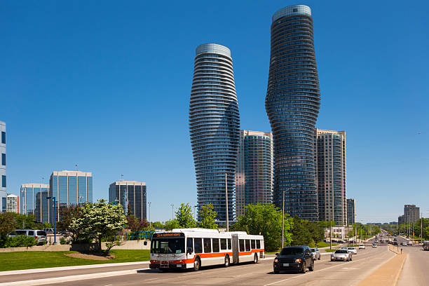 Burnhamthorpe road in downtown Mississauga with modern condominium buildings in the background.